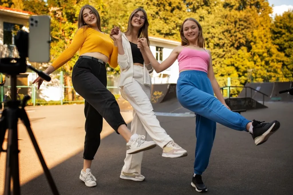 young teenage girls recording reels themselves